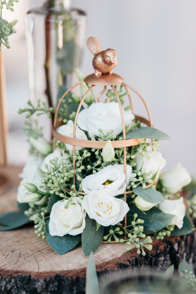gold bird cage with flowers wedding decor