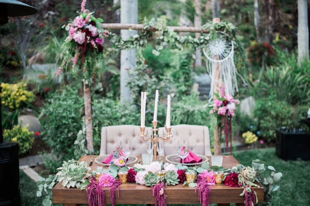 Reuse your ceremony arbor as a backdrop for your sweetheart table