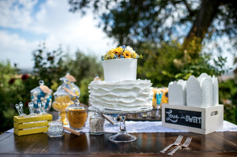 ruffled flower topped wedding cake