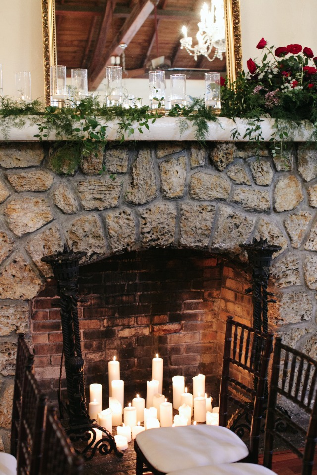 Fireplace filled with candles