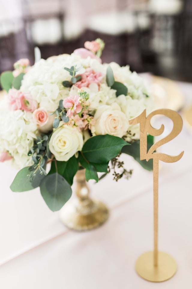 Beautiful centerpiece and gold table numbers