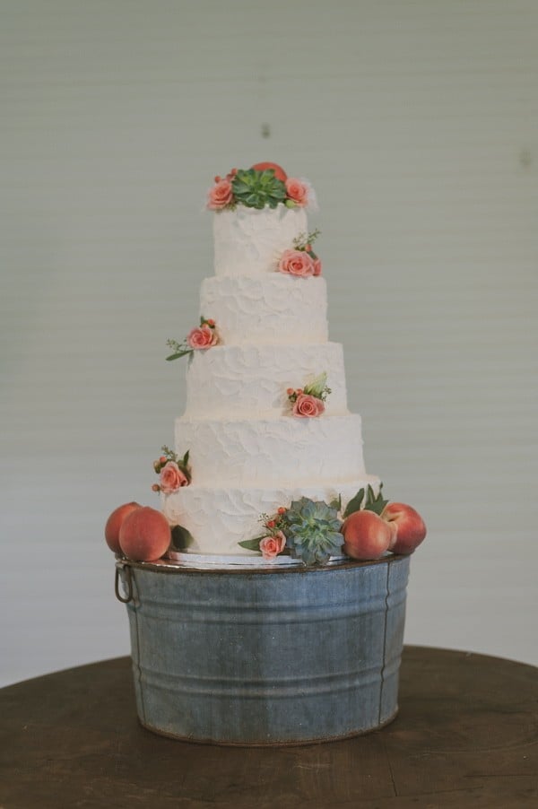 flower succulent and peach topped wedding cake