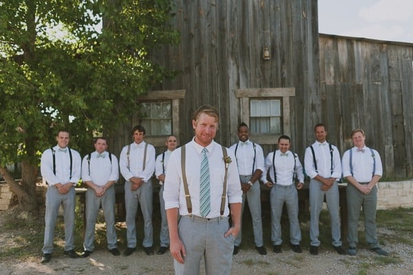 mint and grey groom and his men in suspenders