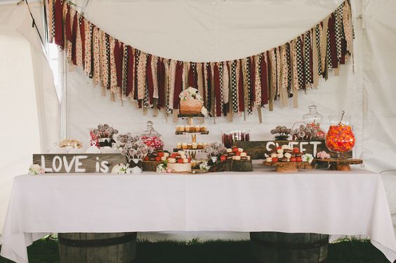 Rustic sweets table with cake, cupcakes, and candies, Love is Sweet