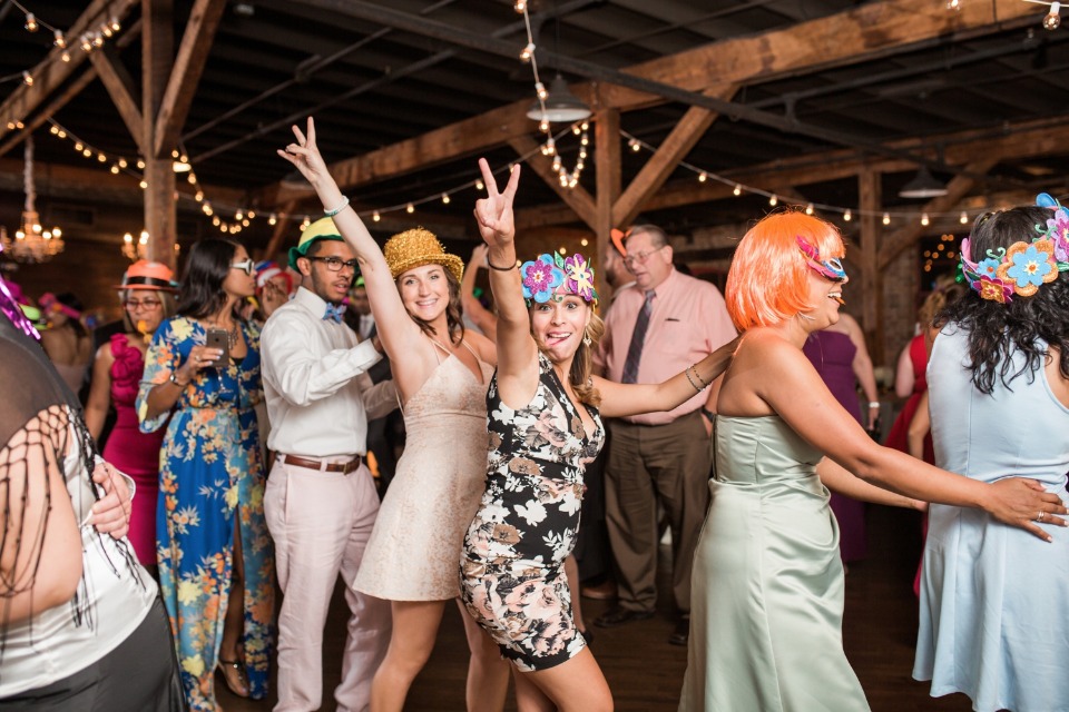 fun wedding reception with fun hats and props