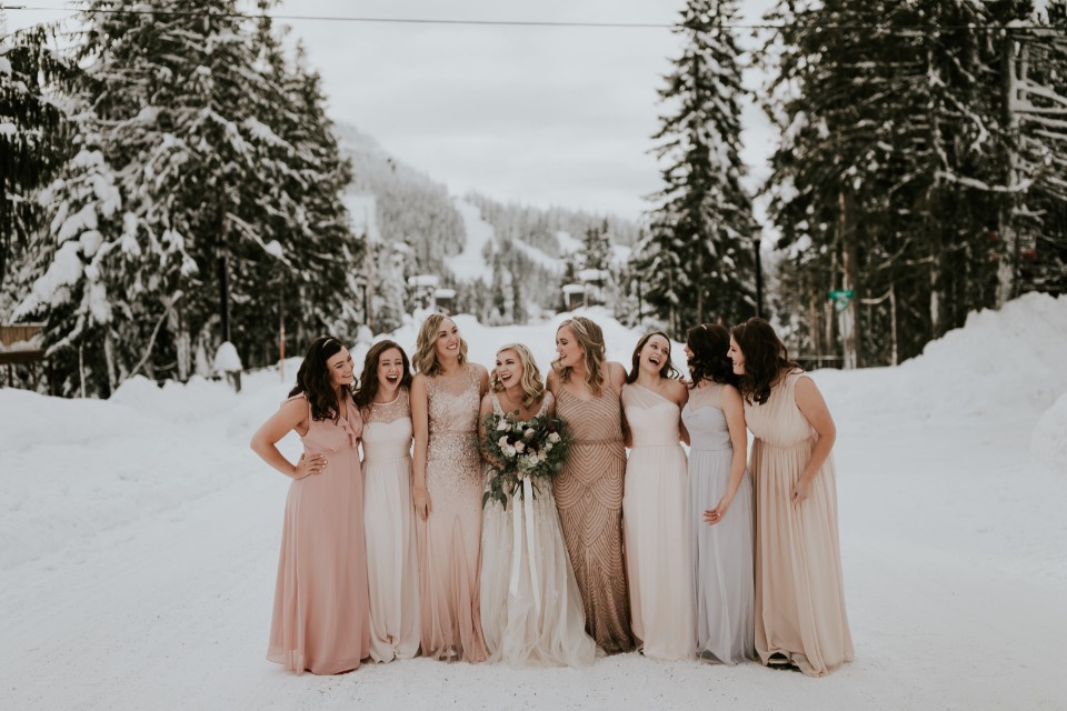 bride and her bridesmaids in blush and peach