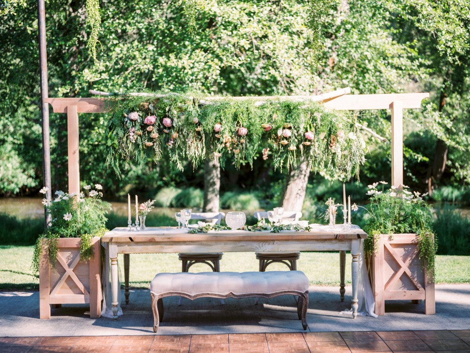 Oversized chic sweetheart table with bench for guests