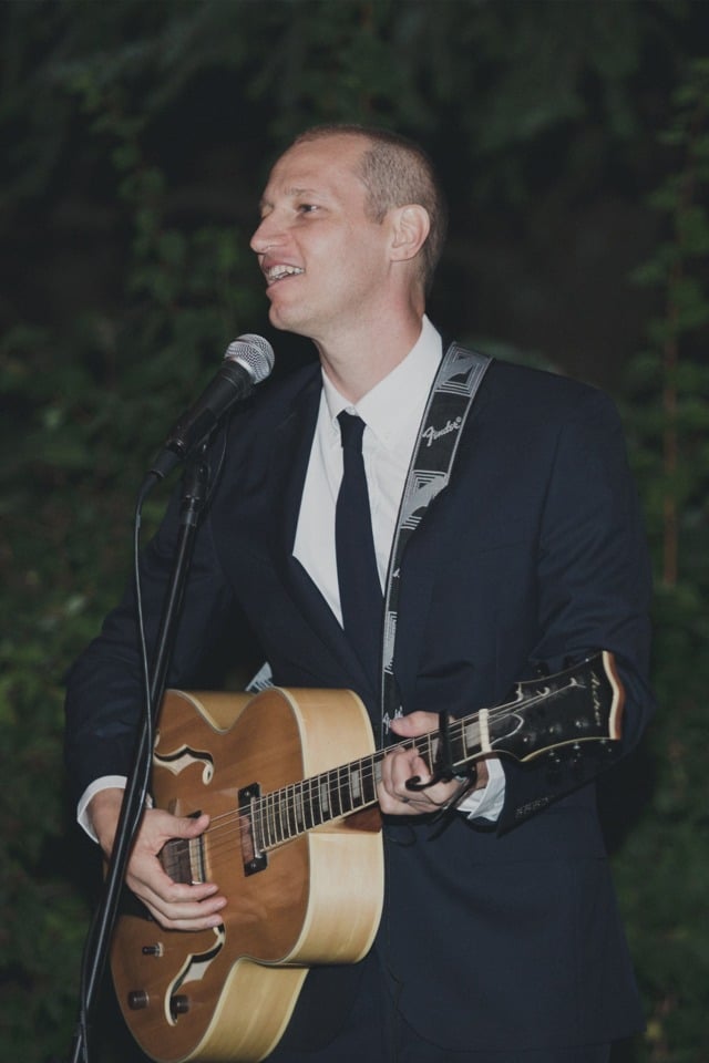 groom singing to his new wife