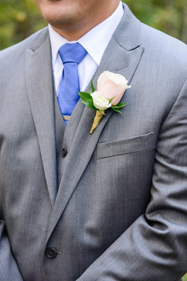 grey suite and blue tie
