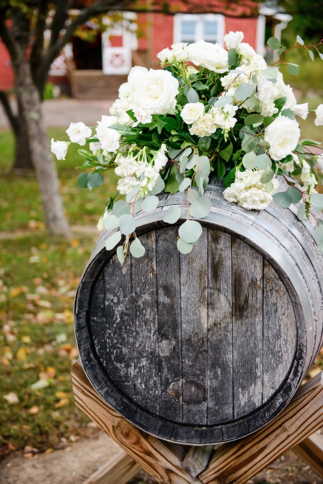 rustic barrel and flower wedding decor