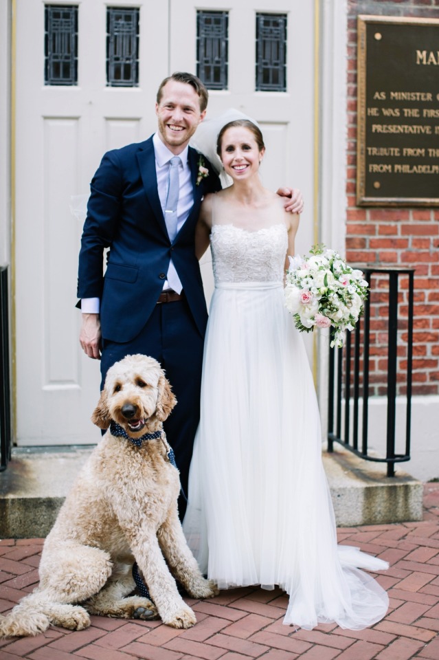 wedding dog and newly married couple
