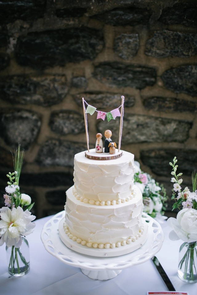 wedding cake with cute custom topper