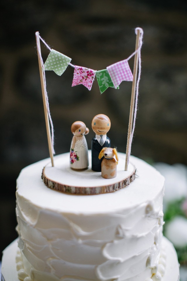 wooden people and dog cake topper