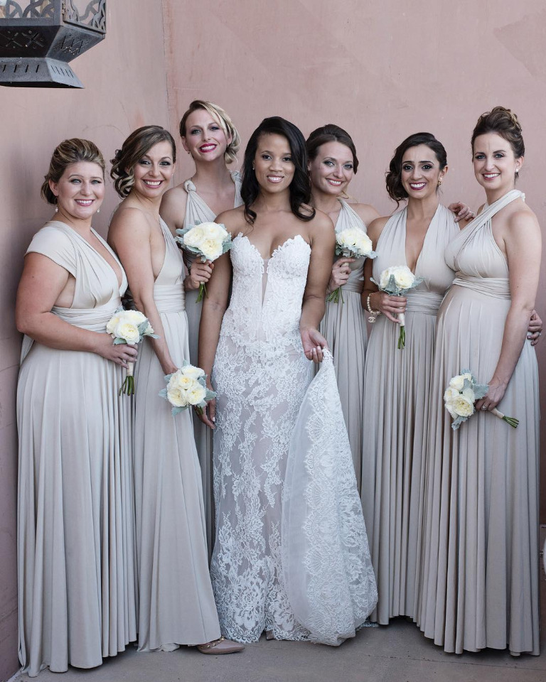 Glamerous bride with her bridemsaids in neutral