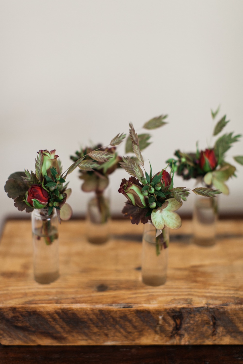 green and red boutonnieres
