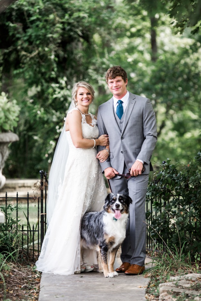 Beautiful couple and their wedding pup