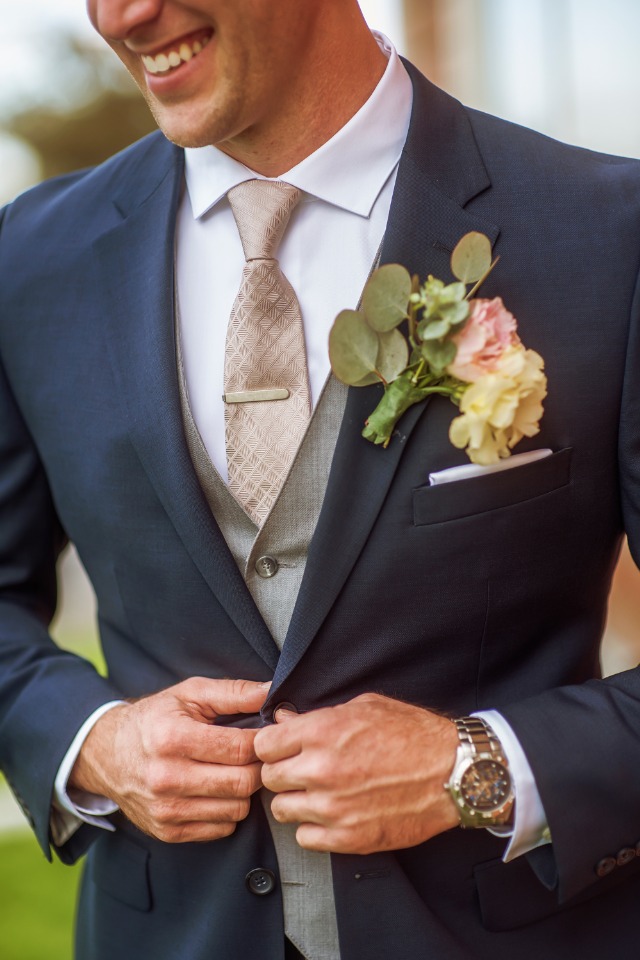 groom in navy grey and champagne suit and tie