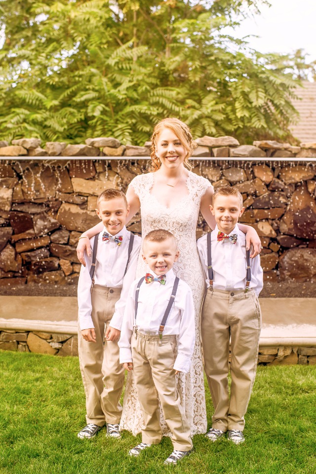 cute little ring bearers in suspenders and bow ties