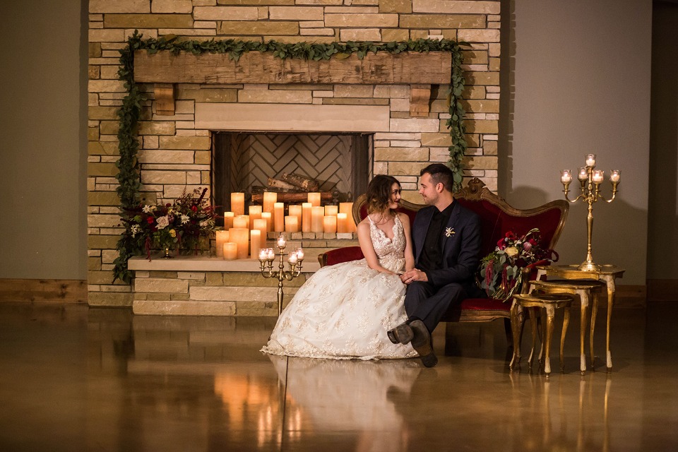 candle lit gold and red wedding decor