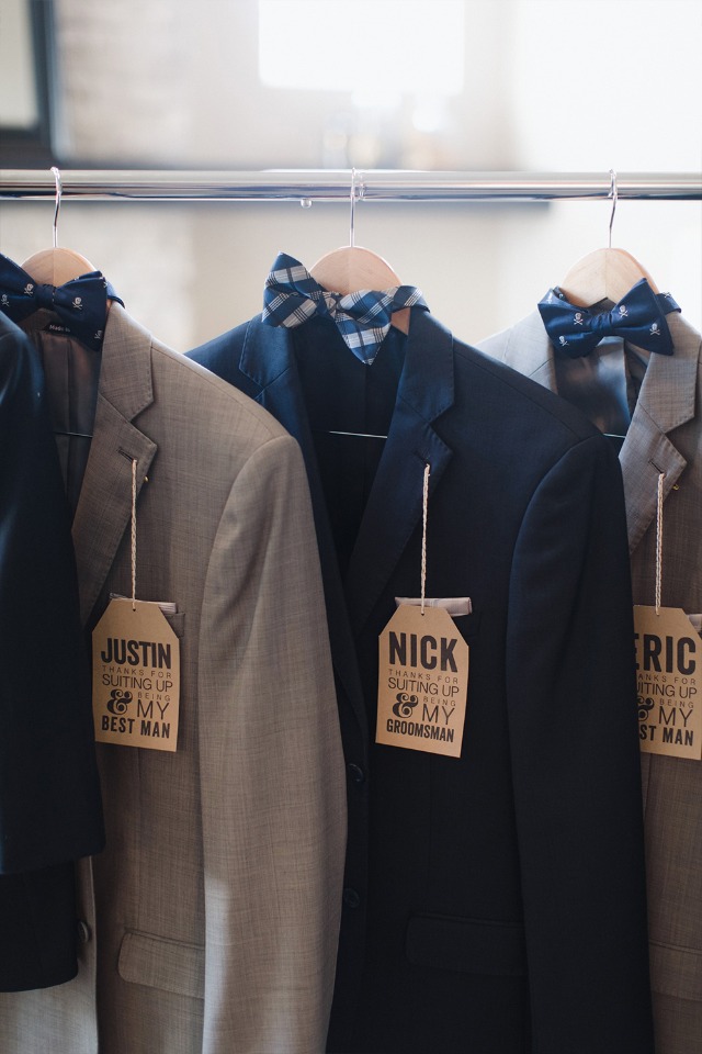 Groomsmen suits hanging up from Generation Tux