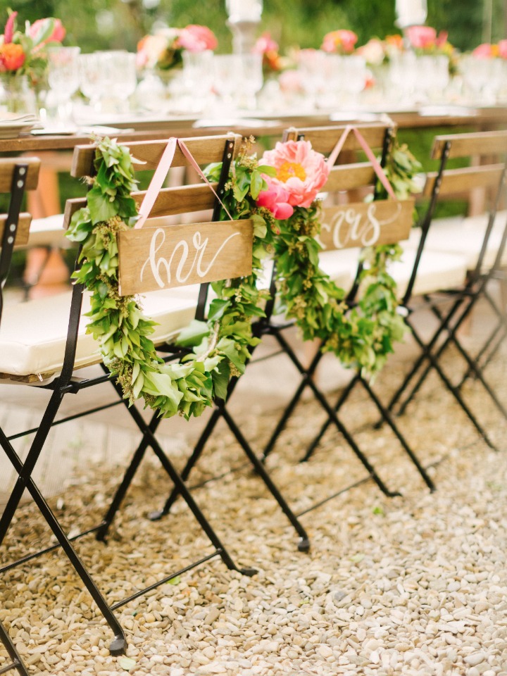 Sweetheart chairs with signs and garlands