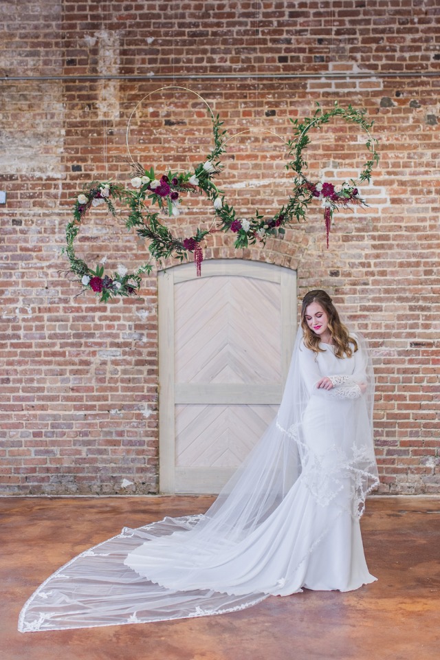 bride in cathedral veil and floating floral wreaths