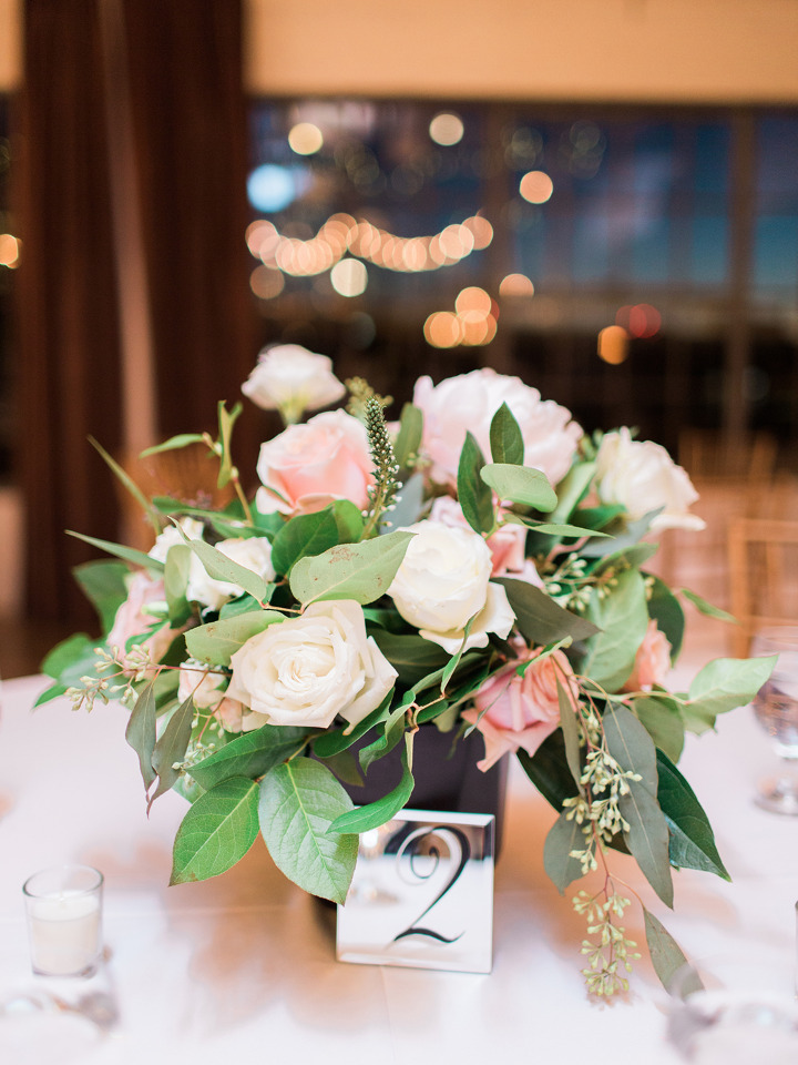 pink and white rose wedding centerpiece with mirror table numbers