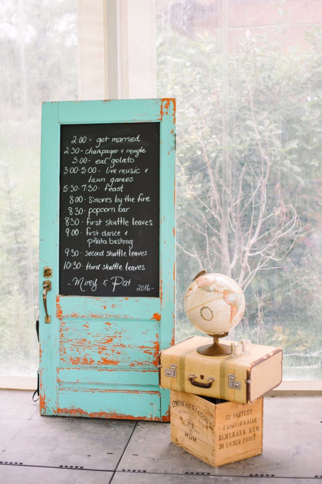 old door chalkboard sign and wedding schedule