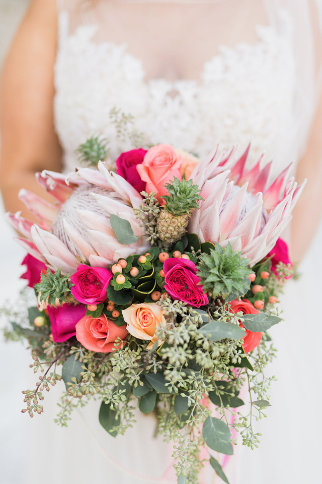 peach and pink rose and protea bouquet
