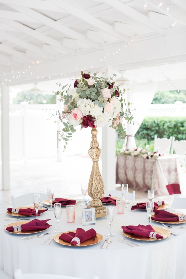 gold and deep red wedding reception decor