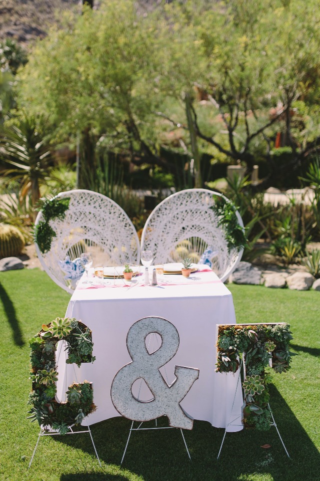 sweetheart wedding table with wicker thrones and succulent signs