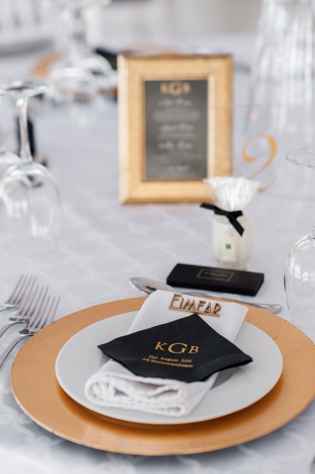black and gold place setting