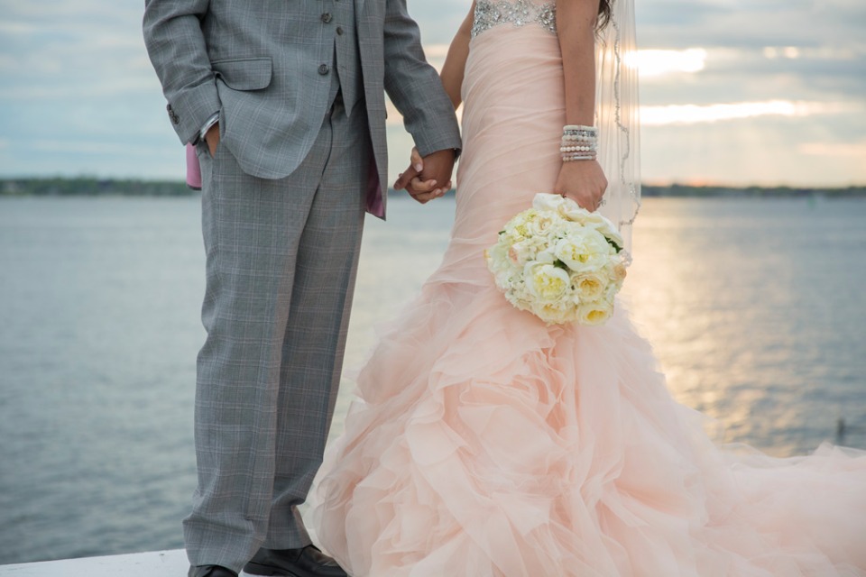 lovely blush wedding dress with some Bridal stacks from Sisco + Berluti