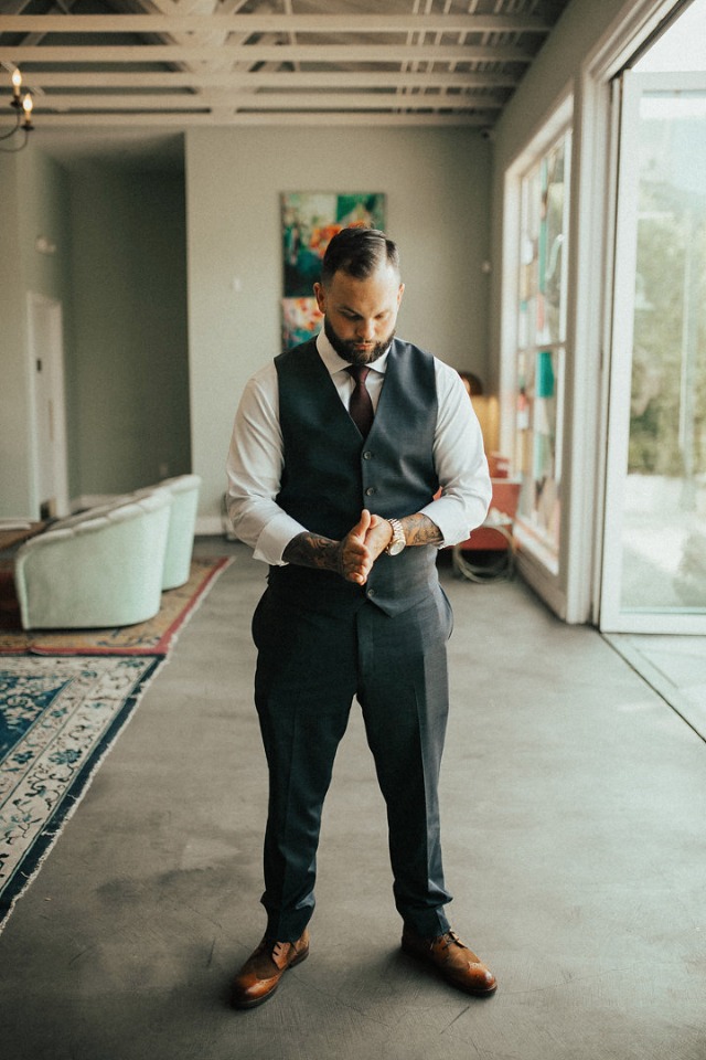 groom in suit vest and pants