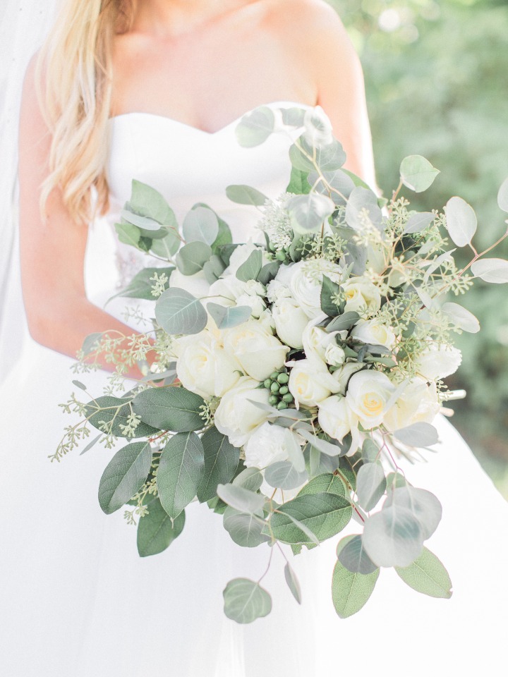Overflowing bouquet with greenery and white roses