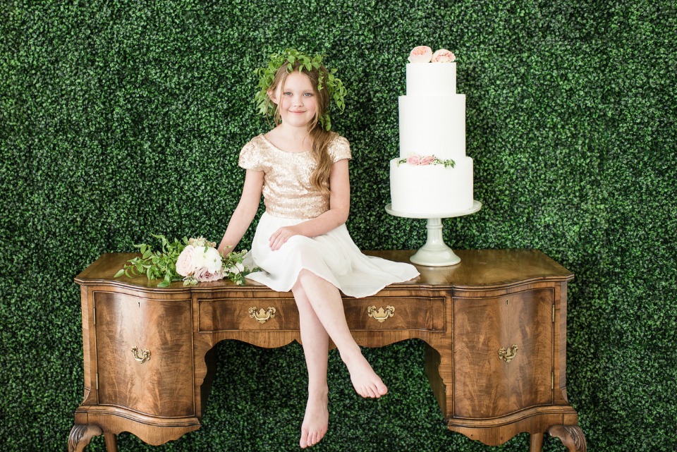 vintage cake table with greenery wall