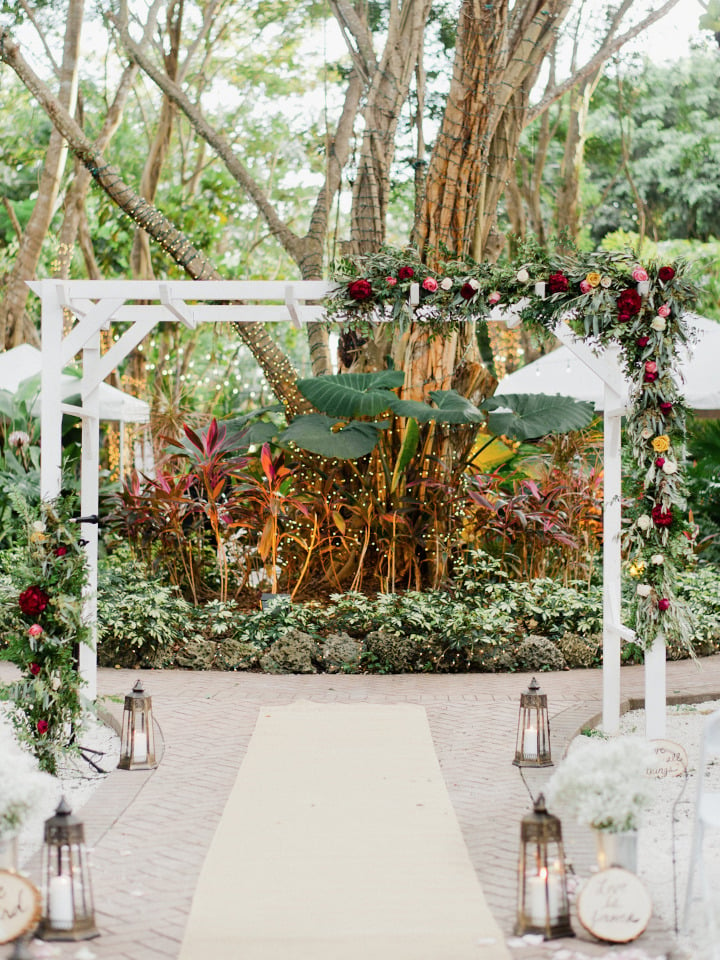white wedding arch with flowers