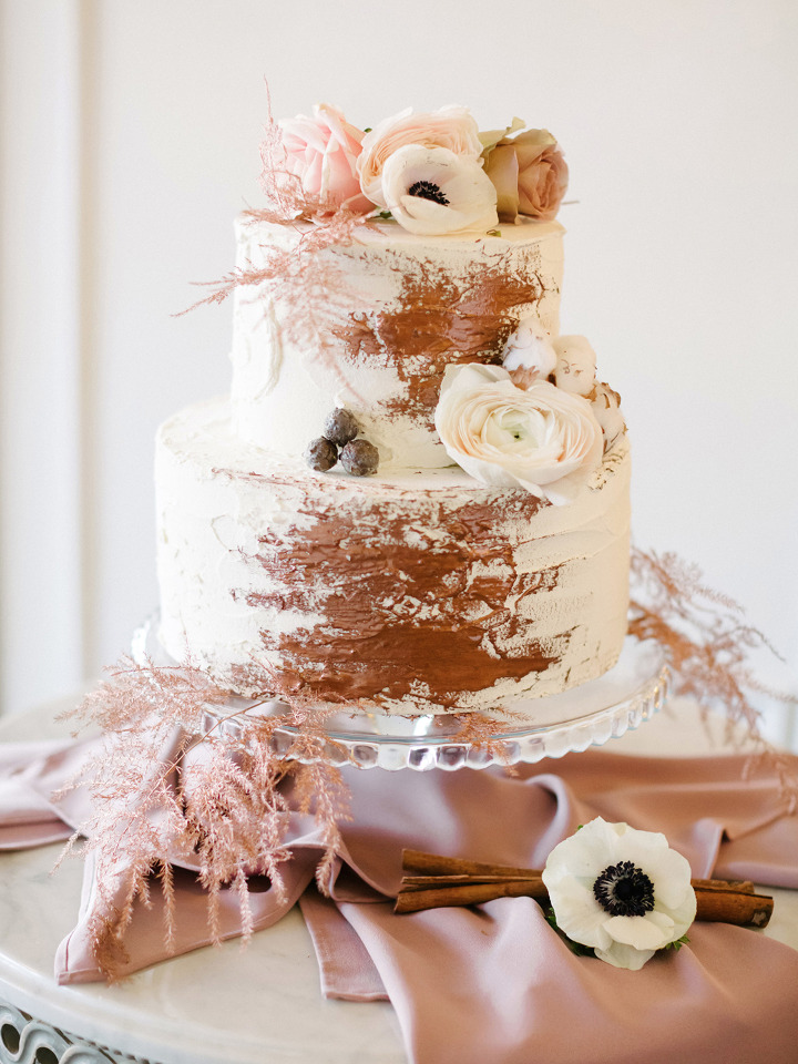 winter wedding cake with floral accents