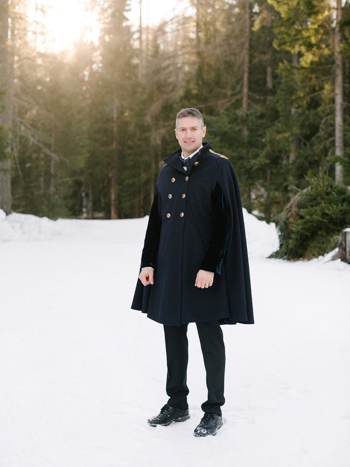 groom attire with cape coat for winter wedding