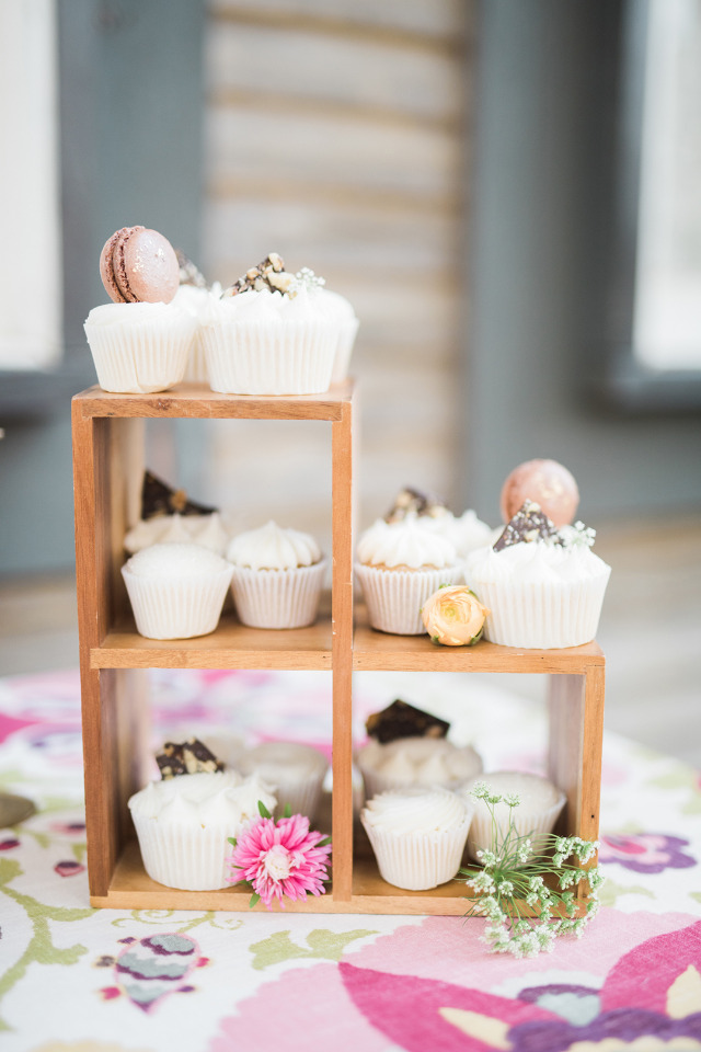 wedding cupcakes with chocolate and macarons on top