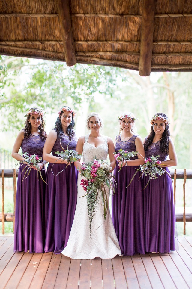bride and her bridesmaid sin all purple