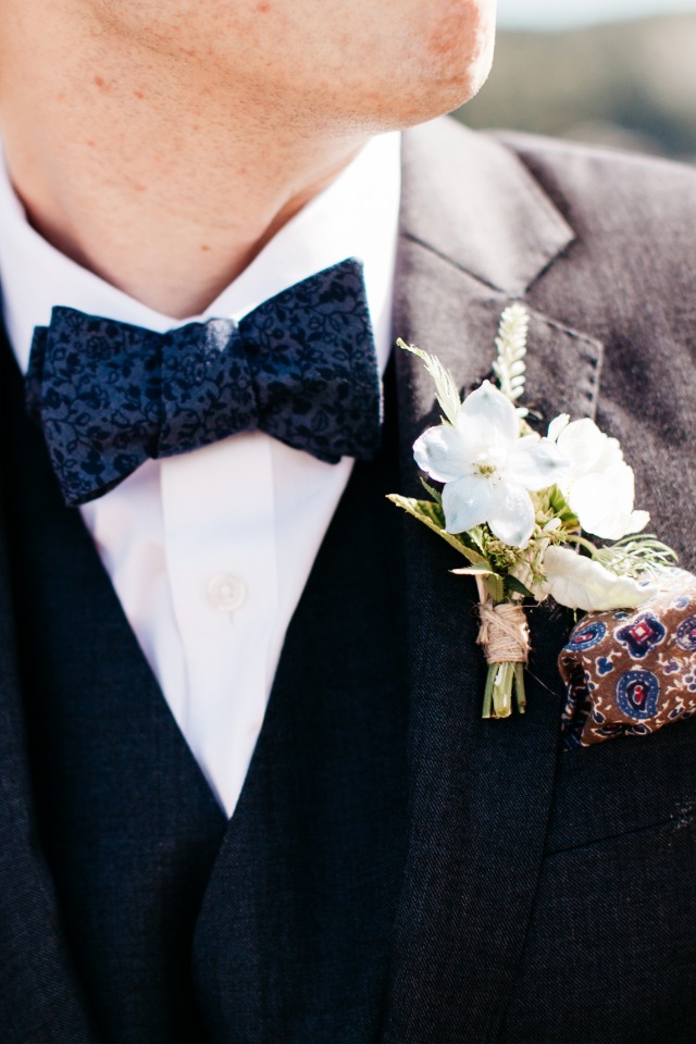 Blue tie and white flower boutonniere