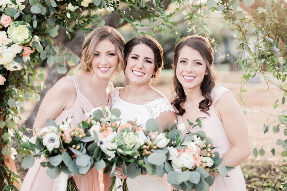 bride and her bridesmaids in soft peach