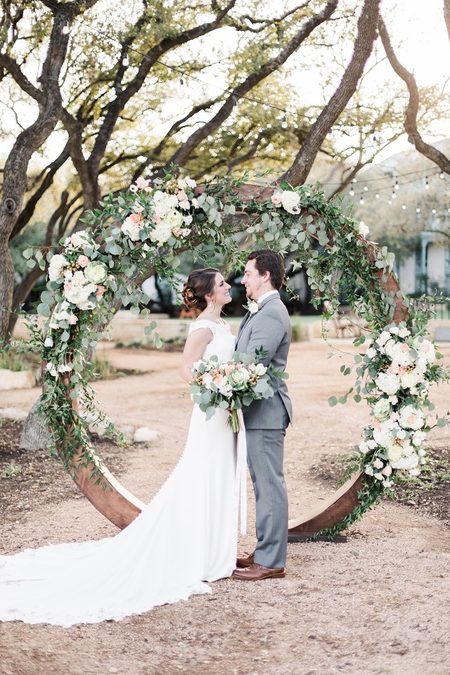 circular wedding arch with floral garland