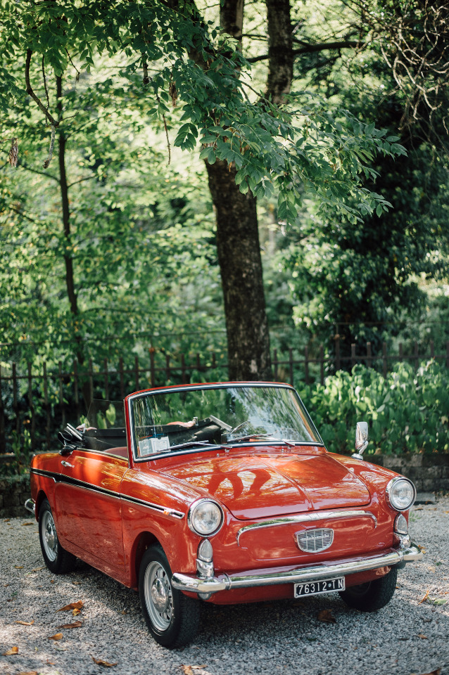 adorable red wedding getaway car