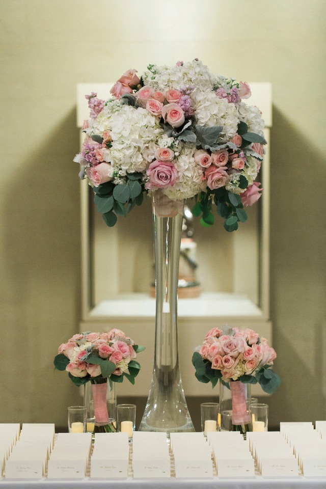 pink and white floral decor for the escort card table