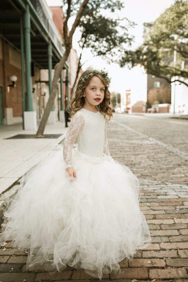 beautiful flower girl in tulle and lace dress