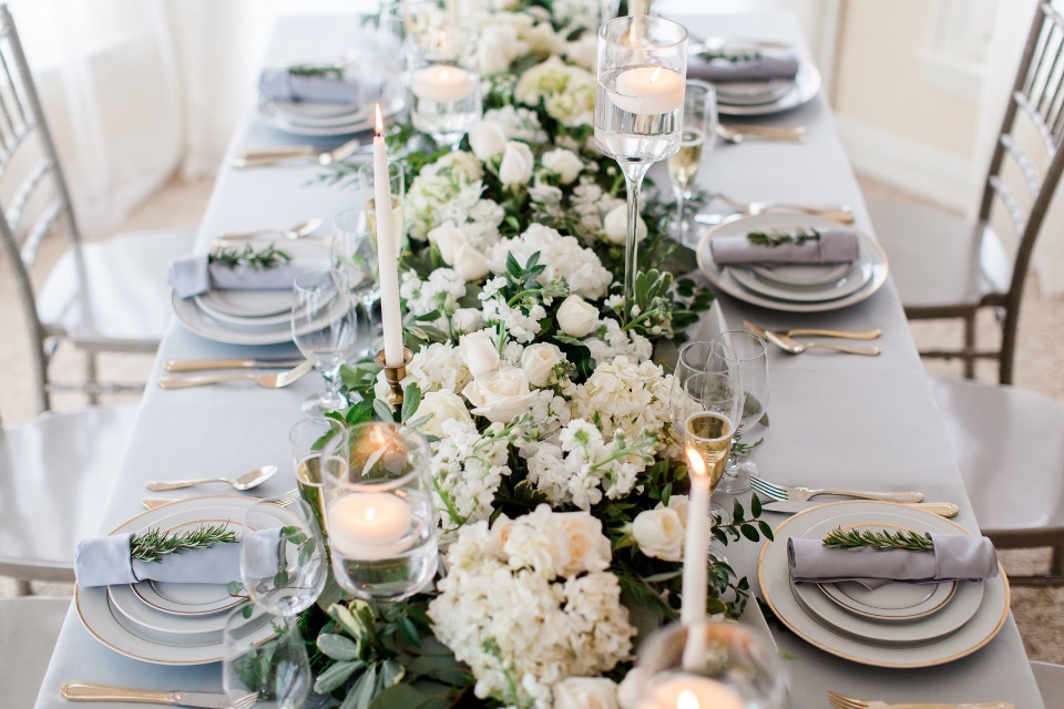 White floral centerpiece with candles