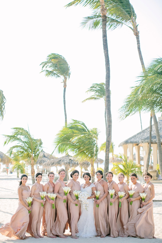 beach wedding with pink bridesmaids in Aruba