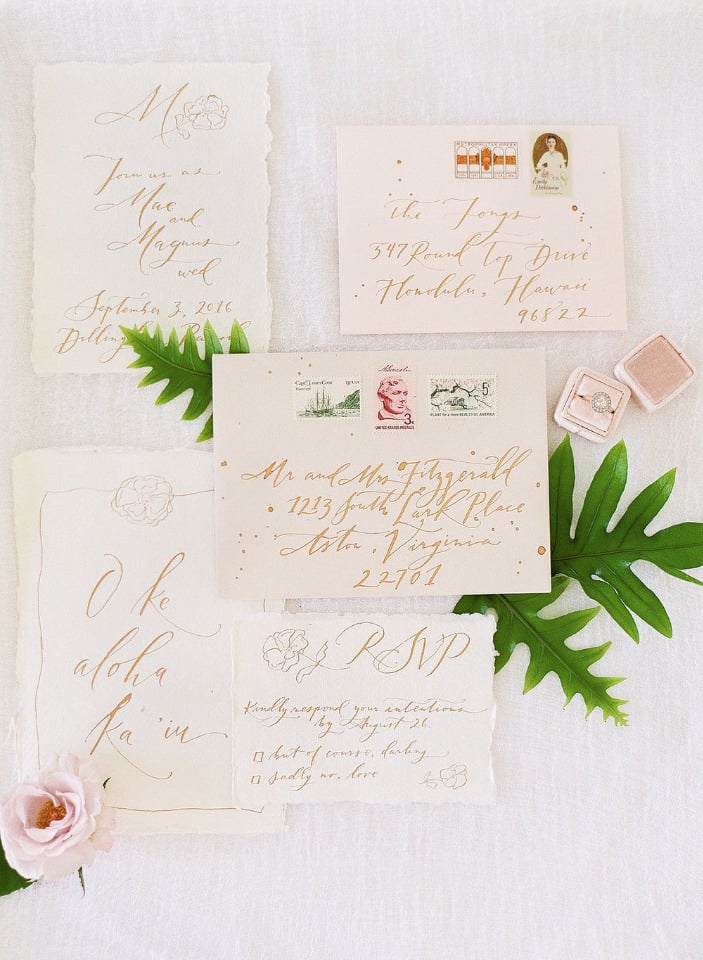 hand calligrpahy wedding invites in gold